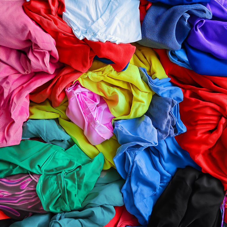 Image of scraps of polyester clothing waiting to be recycled